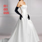Pair of black velvet opera gloves shown on arm; smooth plush finish in 60 cm classic length, styled with a white evening gown.