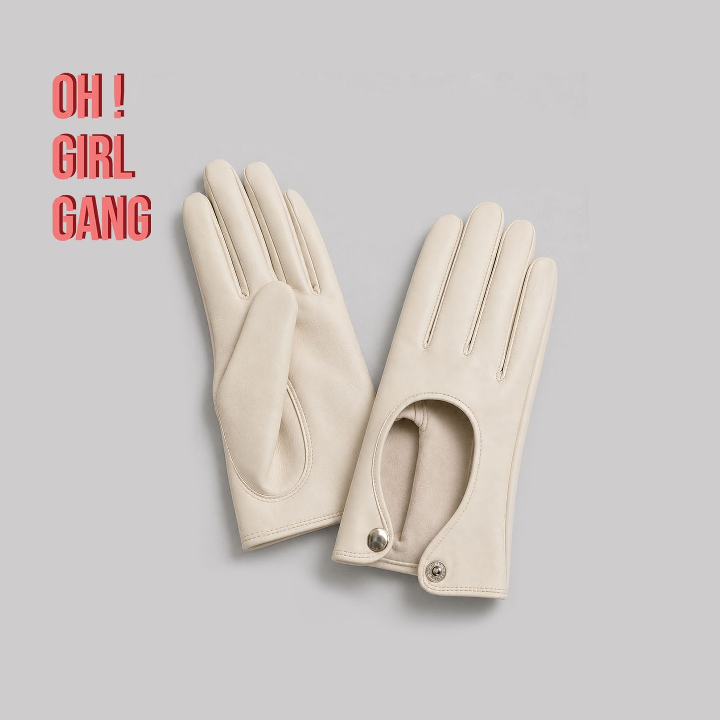 Pair of genuine leather driving gloves in burgundy, white, black, featuring an elegant open-back teardrop cutout with snap-button closure. Soft premium leather with a classic vintage-inspired design, displayed on a light grey background.