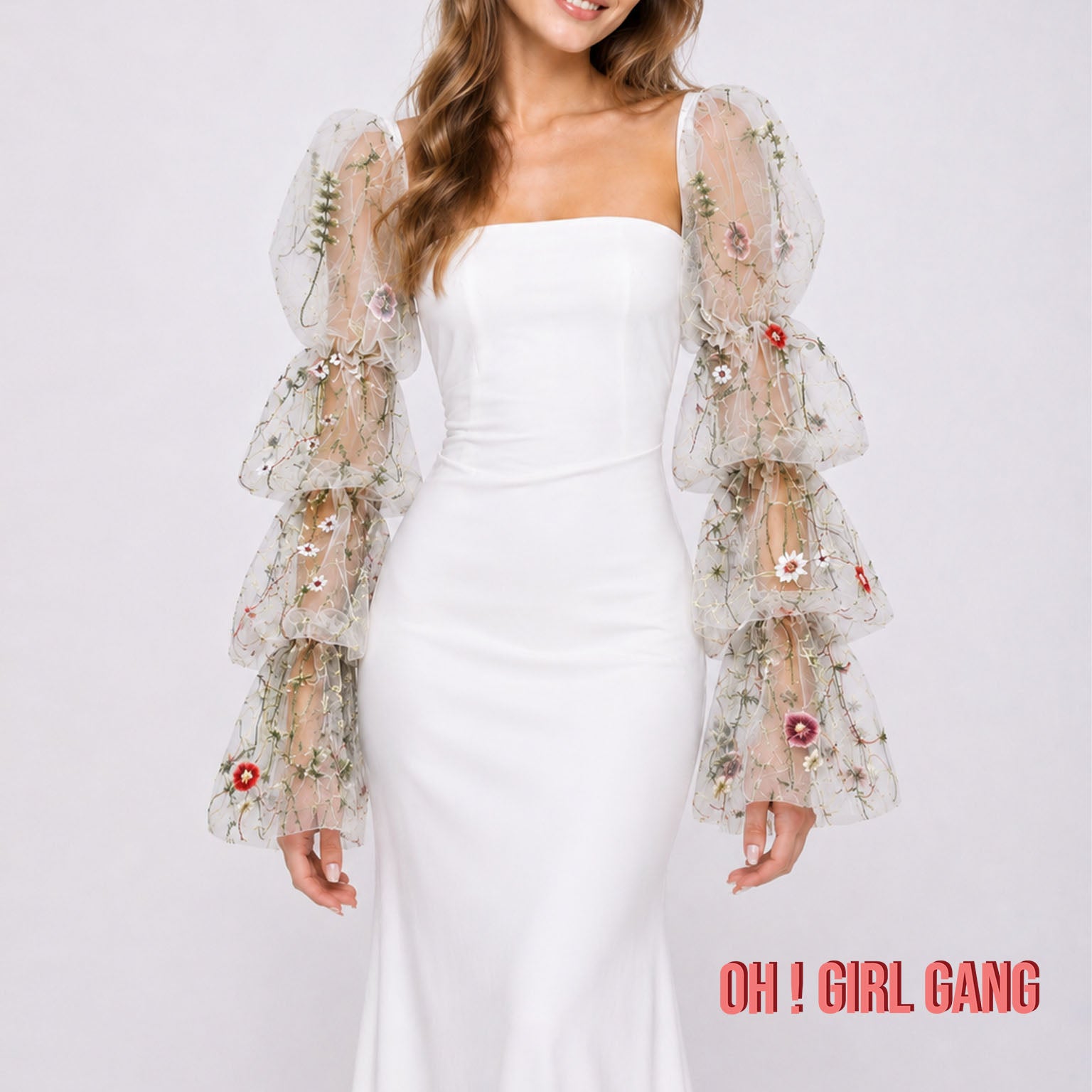 Detachable sheer bridal sleeves with delicate floral details, available in white and black, suitable for boho wedding and bridal styling.