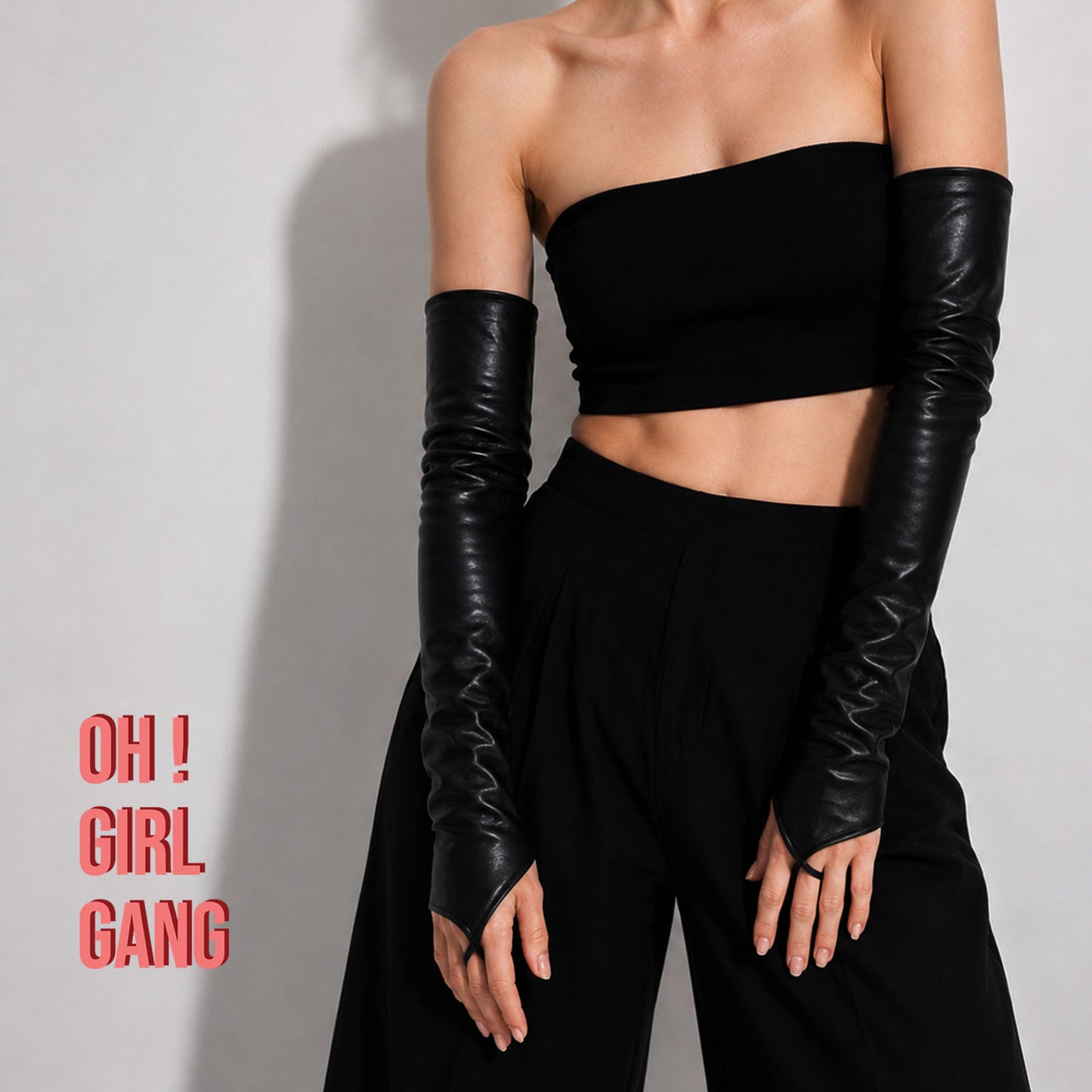 Sleek black fingerless long gloves made from genuine goat leather. Designed with a pointed hand shape and middle-finger loop, available in 30cm, 40cm, and 50cm lengths with sizes S–XXL. Finished with a thin lining for a smooth, comfortable fit.