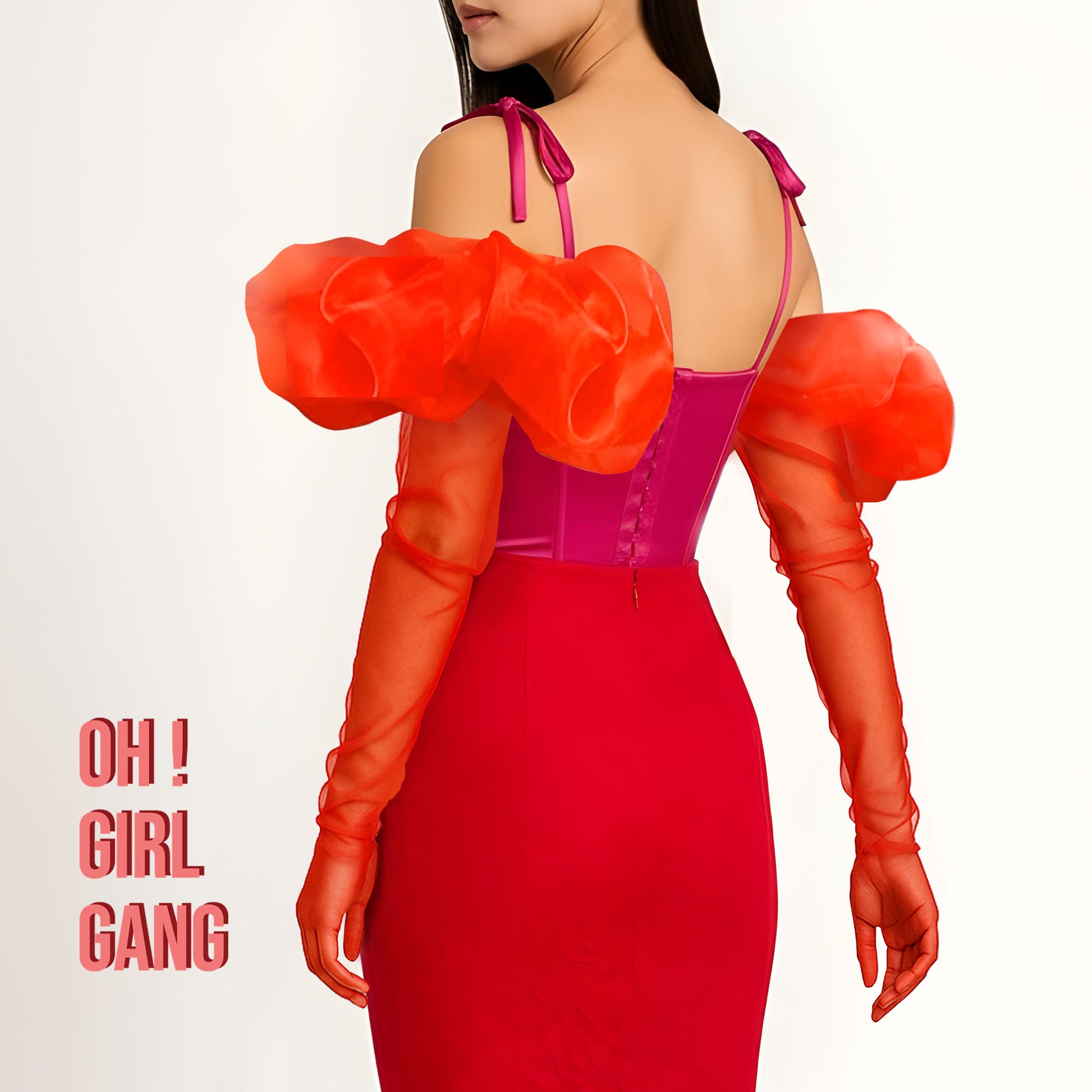 Woman wearing a vibrant red and pink dress with orange gloves on a white background